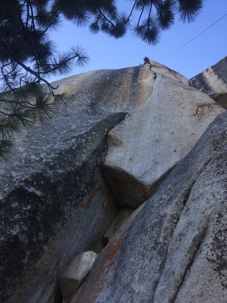 Start up the chimney, then bust left out the roof to the hanging corner