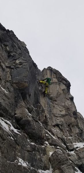 Travis pulling into the awkward off width crux on Dirty Dancing