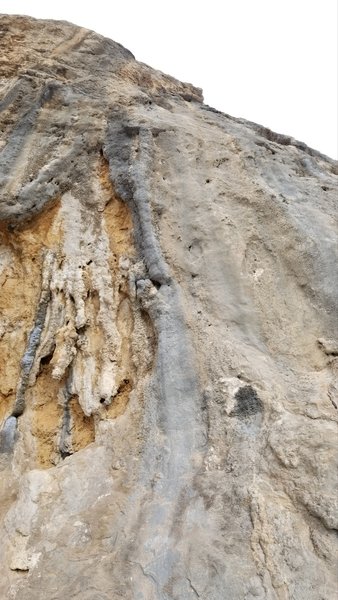 Pitaman skirts the left side of the overhanging section of wall.