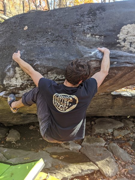 Travis Farnham working through the traverse section on The Egg