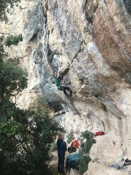 Unknown climber getting into the lower crux
