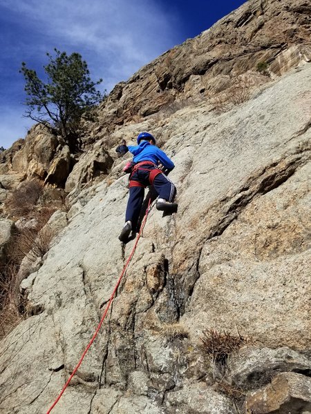 Connor Seeley, age 10, doing his first lead climb.