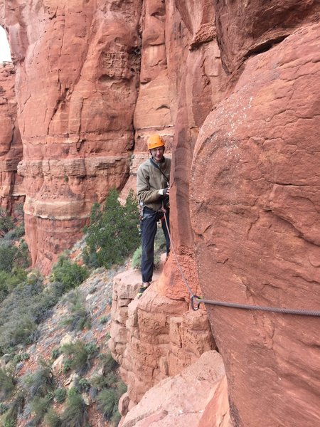 Keith following the exposed traverse. Note you can get pro just before the step across.