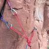 Backing up the single bolt belay at the end of the traverse. Needs some finger sized pieces.