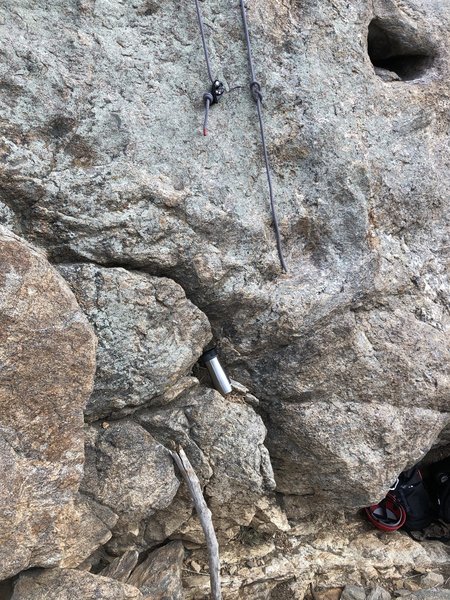 Knot your rope. A 60m isn't really long enough - the GriGri here is about 6 feet above the belay ledge - the belayer will have to climb up a bit to completely lower a lighter climber (with less rope stretch).