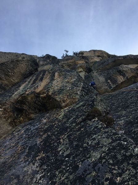 Here is a bad photo of the 10c crux pitch. Ben led right to a dirty crack then back left up a ramp to a horizontal right finger crack. The finger crack in corner seems like the obvious route, but it did not seem to go. Likely has fixed nut.