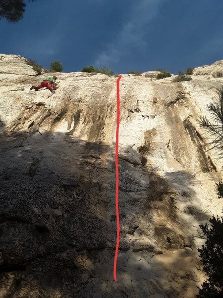 Pilier Direct roughly follows the line in red. The climber to the left is on Chattanooga.
