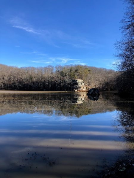 The rock outcropping seen from the damn. The routes listed are on the left side.