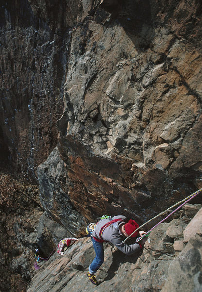 belaying Kim Smith while Ken Nichols and friend follow closely behind. In the background is the well chalked up 'Cat Crack' - Nov 1987