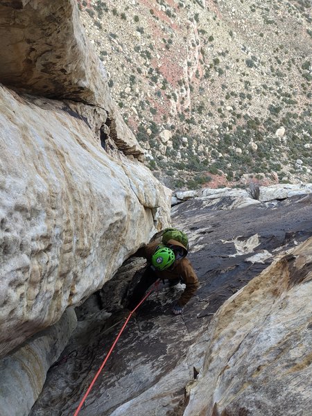 The flake above my follower is entirely detached, and ready to fall directly down onto the belay. It needs to be safely trundled.