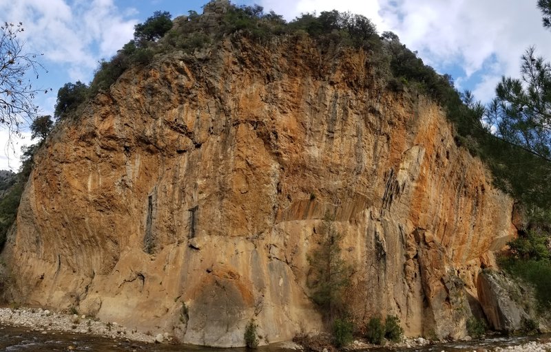 A panorama of Kabe. Walk across the stream to access the base of the cliff.