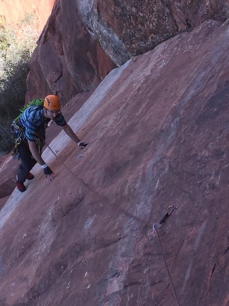 Keith coming up through the crux slab on P1.The crux is a bit slippery but well protected.