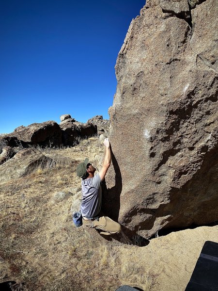 Young, starting on the rounded arete of Road Kill