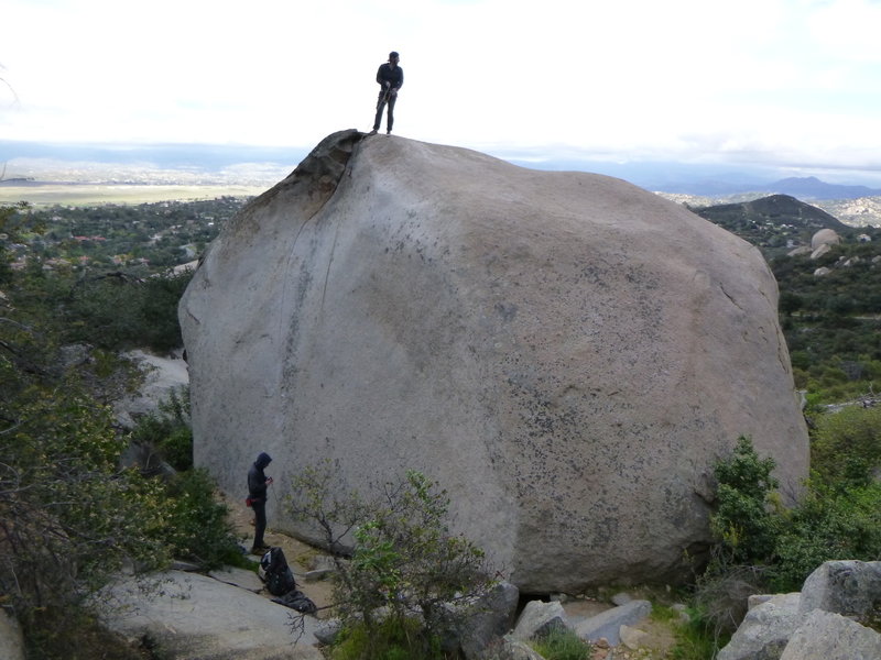 A view of the whole boulder. 5.7 slab to set up a TR is by the small tree on the right side of the picture.