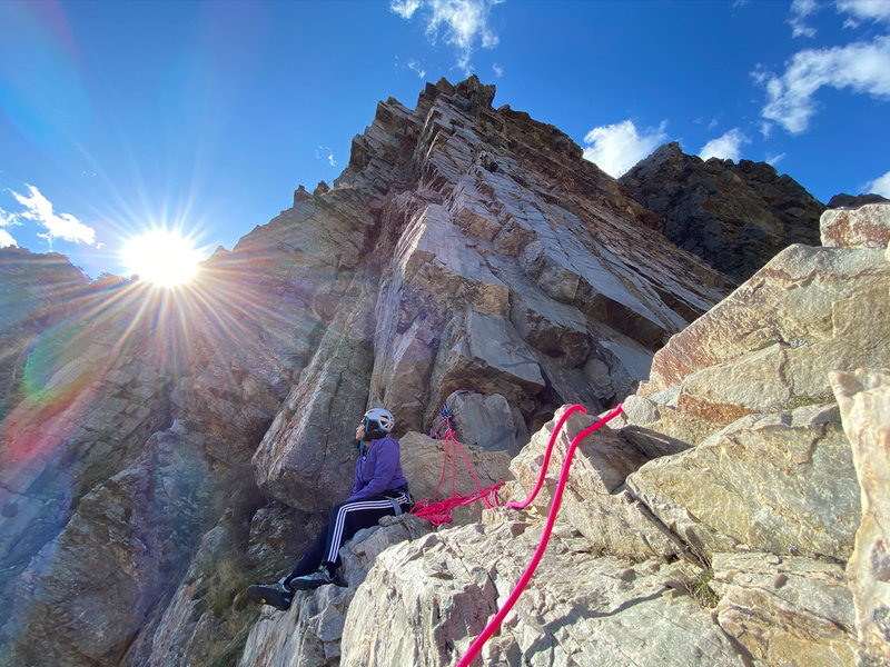 A brief respite of warmth on an otherwise cold and blustery day. Enjoying a break on the big ledge - top of Pitch 1.