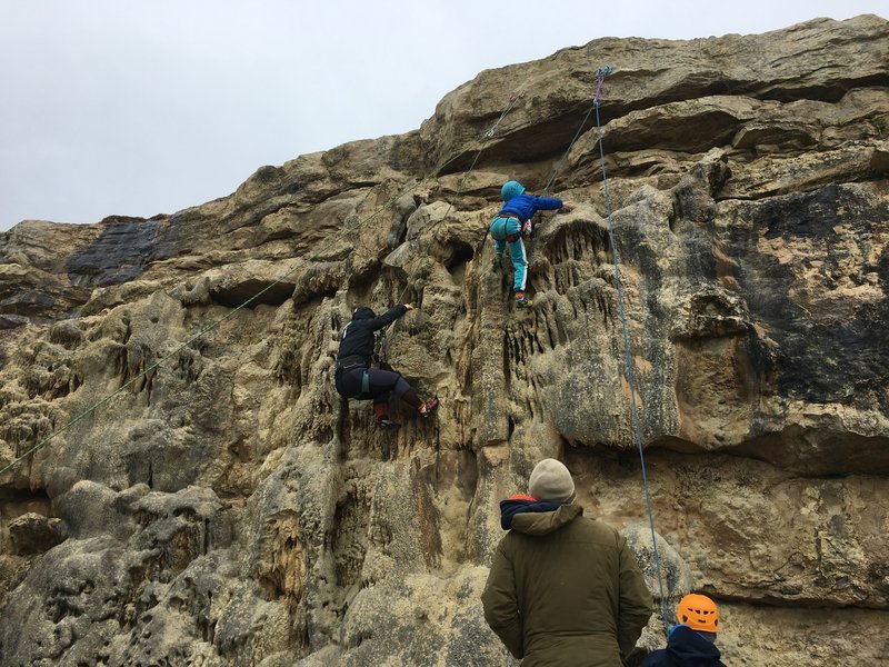 Climbers on "Surf, Sun and Just having Fun" and "The Mighty Bush" (left to right respectively).