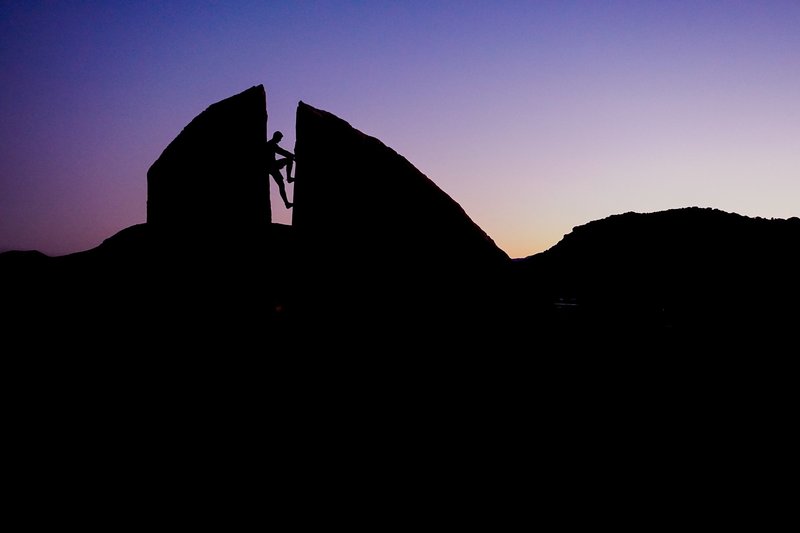 Lovely sunset colors and silhouette while descending the great Plumber's Crack boulder.