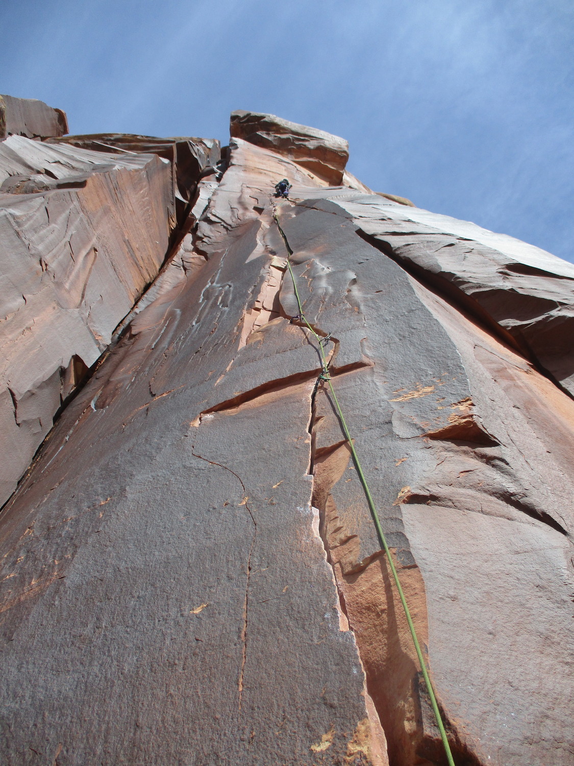 Steph at the anchors atop Keyhole Flake. The first crux is climbing the trapezoidal flake at 1/3