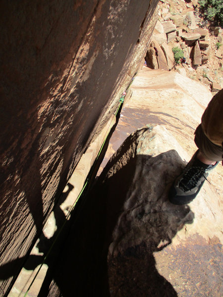 View down from the anchors. Rather than chimneying straight up, I went deep inside the chimney where it was more secure and then traversed back out at the top.