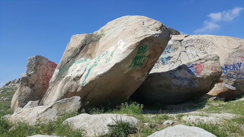 Left side of arete, move right to mantle topout