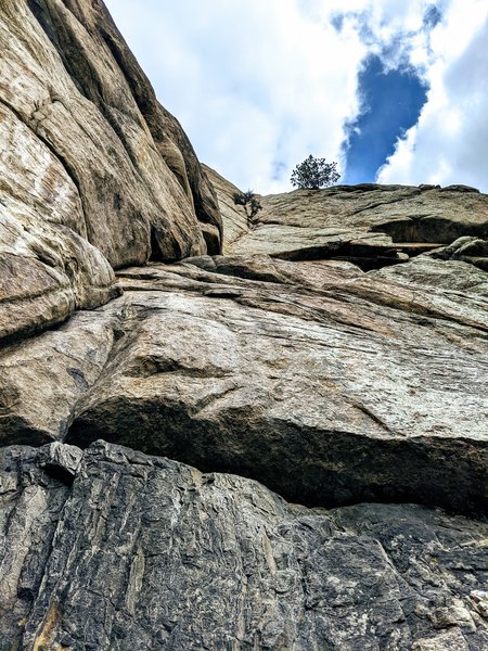 Short 2nd pitch of Standard Route. Easy climbing up black streak then a couple of serious moves in well protected crack before you gain the ledge and next set of bolted anchors. If continuing up standard route, do not use those anchors look up and left