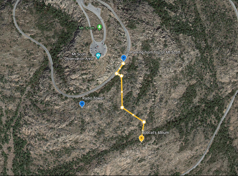 Access from parking above Bobcats Atrium. 0.22 Miles downhill. A route is manageable from Radio Tower. Make sure to head East if you see the lone boulder sitting on top of a slab while taking the Radio Tower route. The Atrium is just NE of boulder.