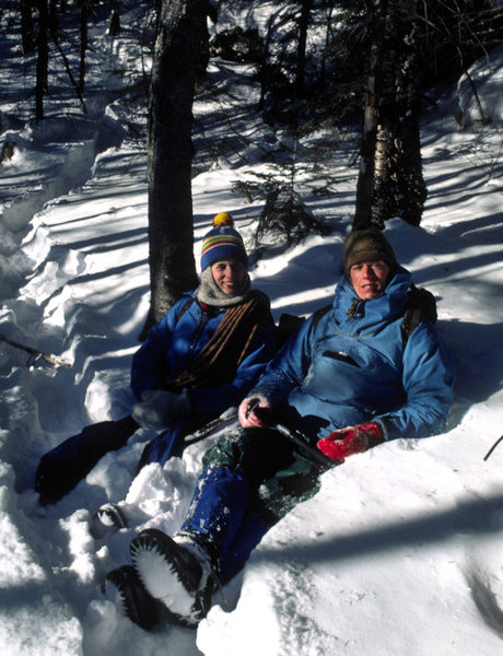 Mary Erdei and Ken SIms enjoying the warm afternoon sun while pausing in the 'rut' while descending from the 'Dike' in March 1980