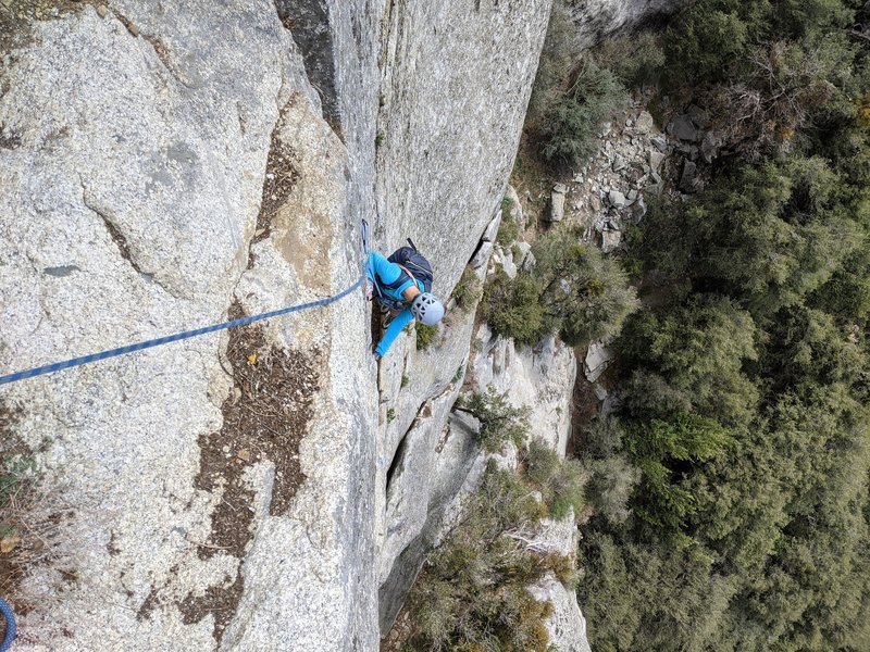 nearing P2 top, brief rest after 5.10+ face before 5.10+ finger crack if on original start