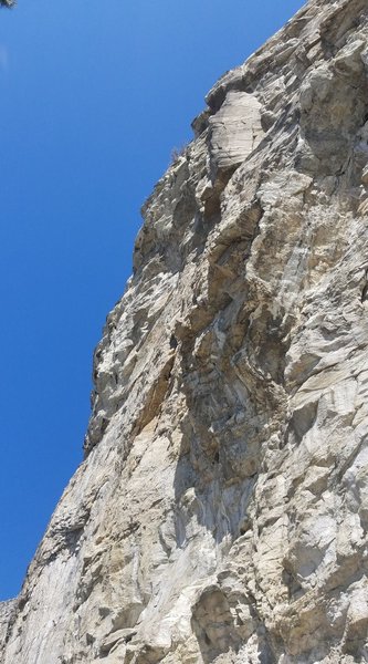 Bulging face, followed by the slab, and finishing on the arete through the roof.