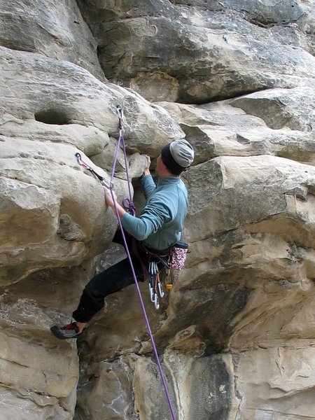 Matt grappling with the start of the unknown route left of Broken - 09 Nov 2003