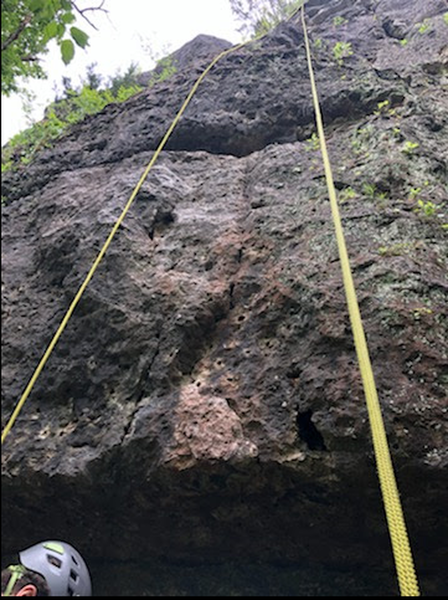 Start on the lighter colored rock. Rest of the route follows the left side of the rope in the picture.
