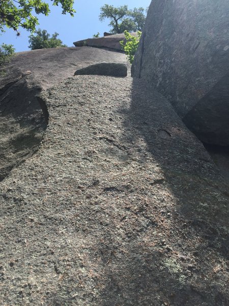 Starting slab boulder with undercling in view higher up