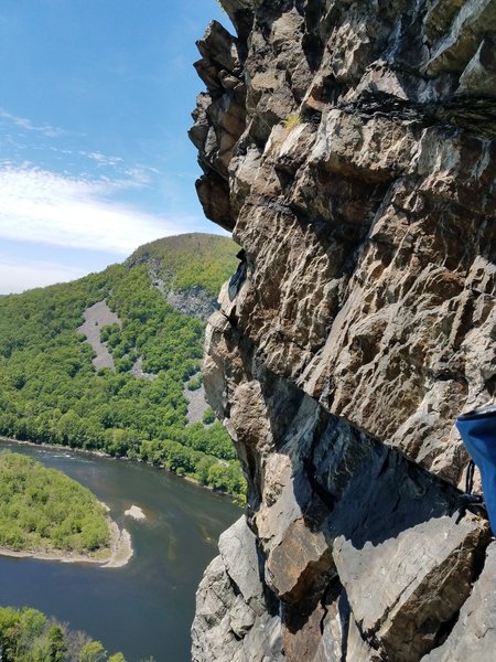 View from the belay spot. Tempting to traverse left from here, but your path is instead 15ft further up the corner until you hit the roof; then traverse left 90 degrees....manage rope drag with double length runner.