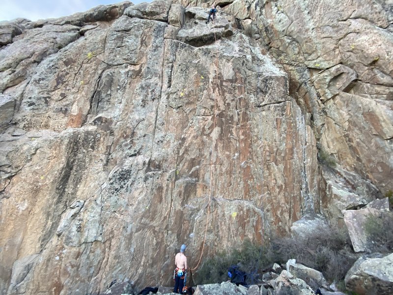 The micro crimp didn't blow! Noah Kaufman on the FA, mounting into the slab section above the crux.