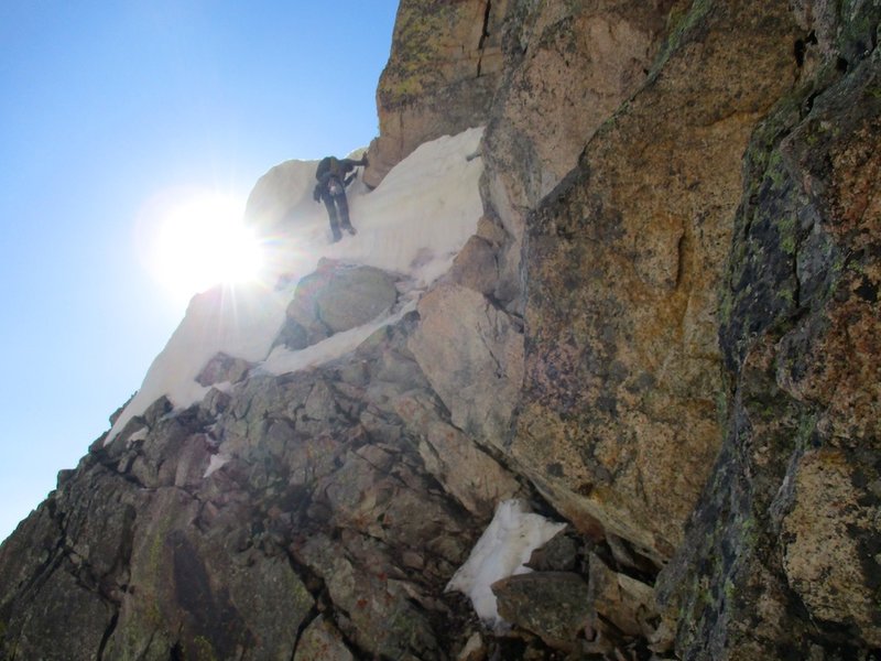 Negotiating the early season steep snow/ice at junction between North Chimney and Broadway Ledge. Crampons and ice axe were nice to have.