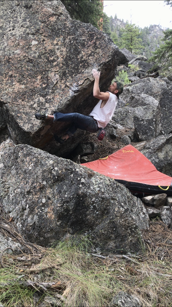 A cool short V3 squeeze problem on the downhill side of the Relic boulder.