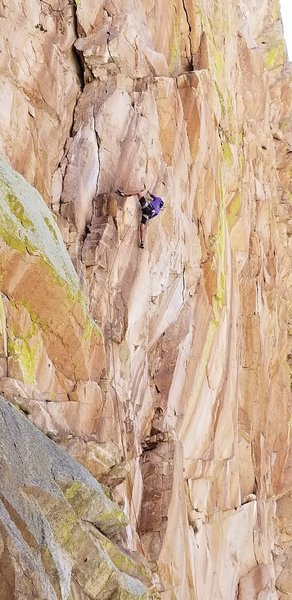 Will Buttierrez in the crux of the upper headwall.The whitish crack the curves left is what Gerrod followed to into Direct North Face corner which he climbed to the fat part, then he climbed the short thin vertical crack until possible to traverse right.