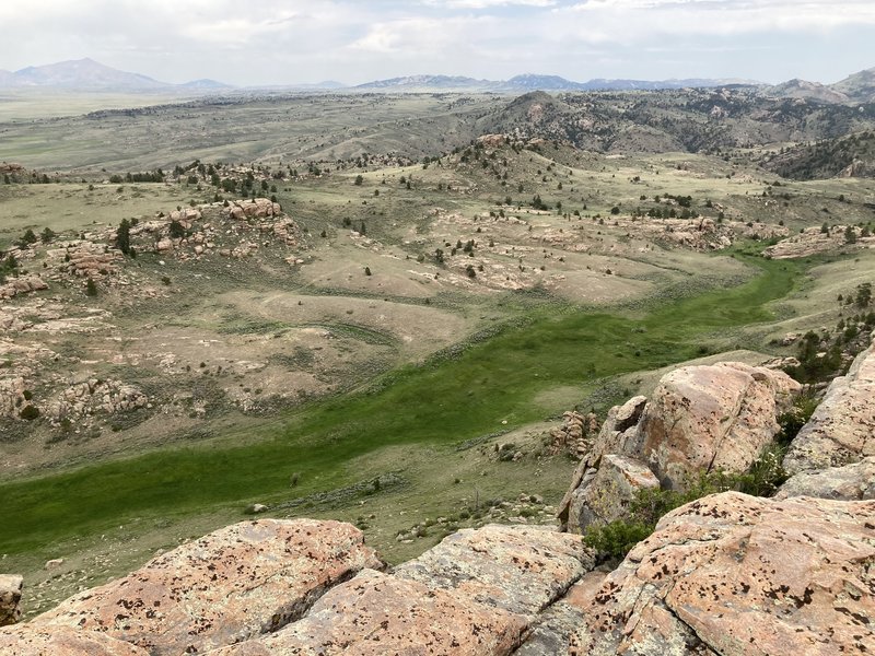 Break Up Rocks sit on the conelike mound in the upper just right of center