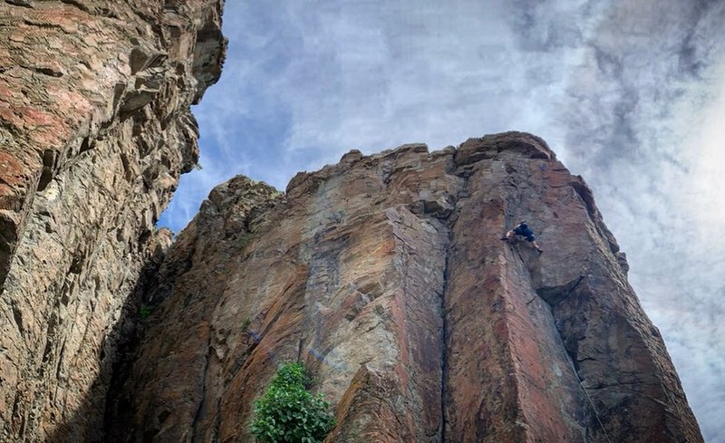 Chase working the crux up to the anchor