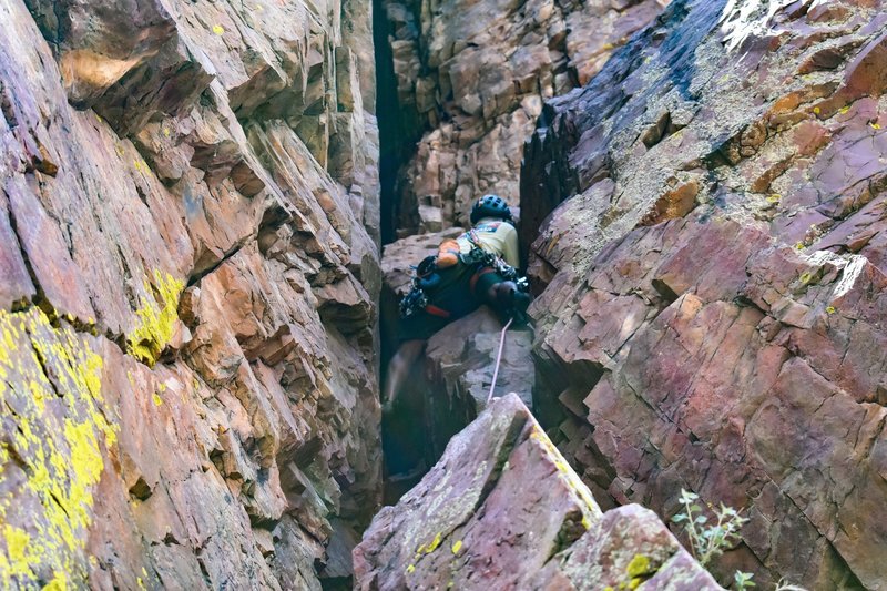 going up the first pitch. once reaching the ledge, go up and left to the bolted anchor for Vertical Addiction. If you're doing this, make sure to extend your last two pieces when you exit the tunnel and turn left, because it is a ways left.