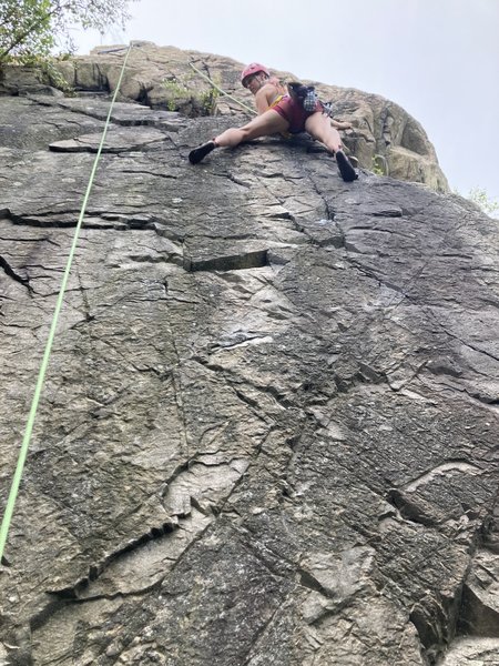 A climber after the crux on Quickstep when it meets with Hair Line.