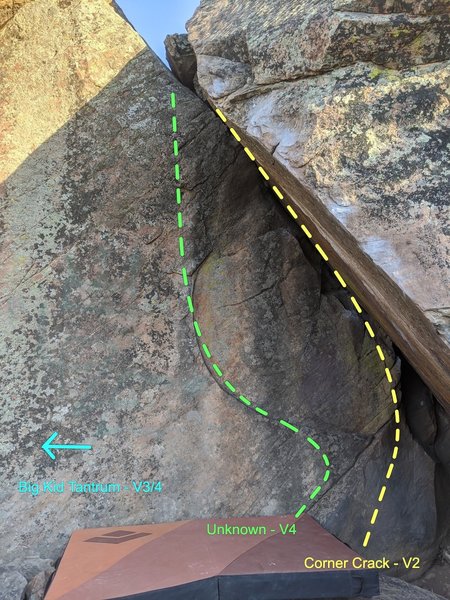 Follow the curve of the crescent feature, staying away from the crack (V2 problem to the right) and just using good edges and underclings. Top out just left of where the rocks join.