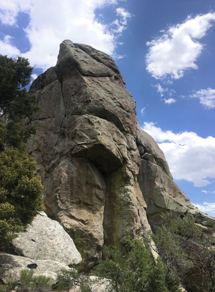 View of the roof crack, and the upper sections of face climbing on the route.