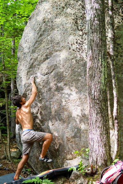 Dominic figuring out the beta sequence for the boulder.