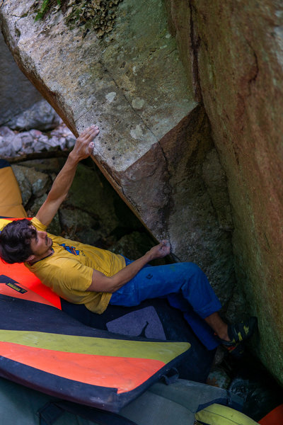 Dominic's right hand is on the start Hold of changing corners