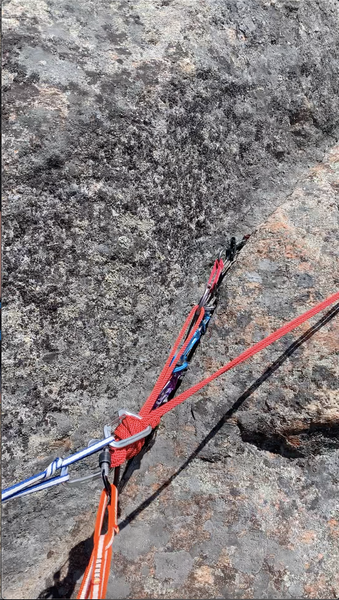3 piece anchor at P2 belay station. Mark included the last bolt of P1 in the master point. Unnecessary in the eyes experienced climbers albeit emotional support to supplement lack of confidence in building aforementioned anchor for us.