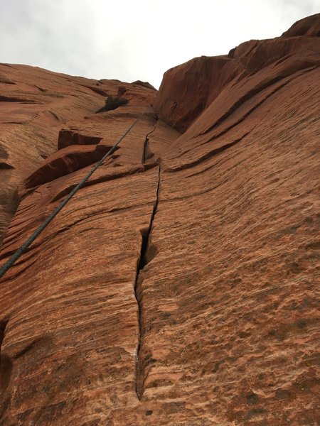Middle section of P3 with the crux in the corner up high.