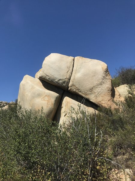 An interesting boulder. Cootie Catcher runs up the main line.