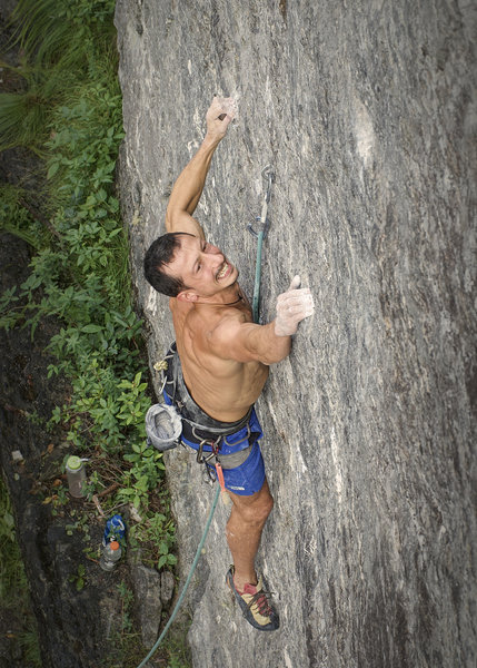 climber moving past second bolt