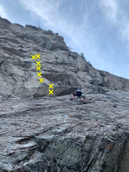 Skip the belay the top climber is at. Instead stay left and follow the bolt line.